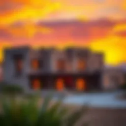 An elegant desert home showcasing traditional architecture against a sunset backdrop.